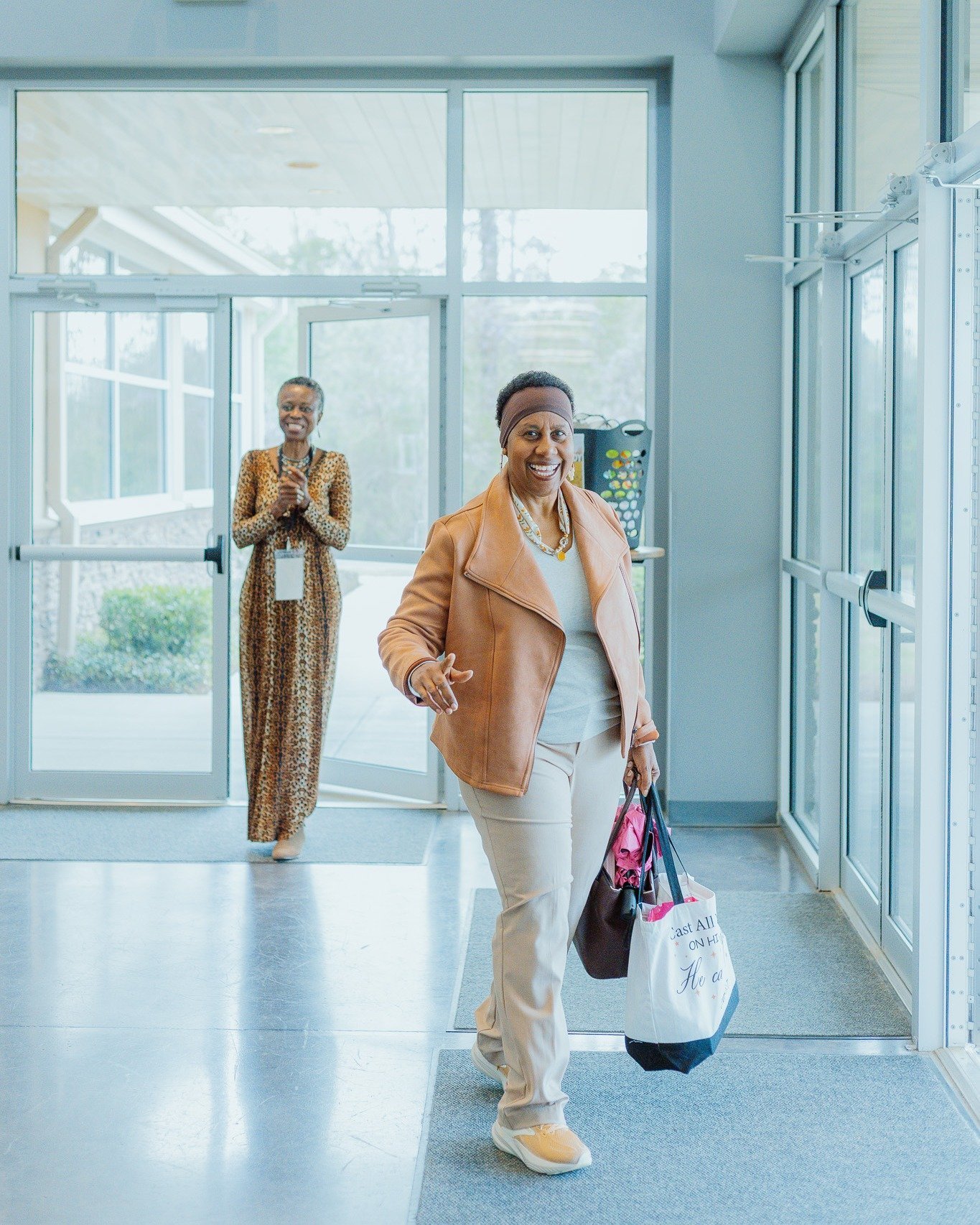 A woman arriving with a warm welcome at Stone Edge Sisters